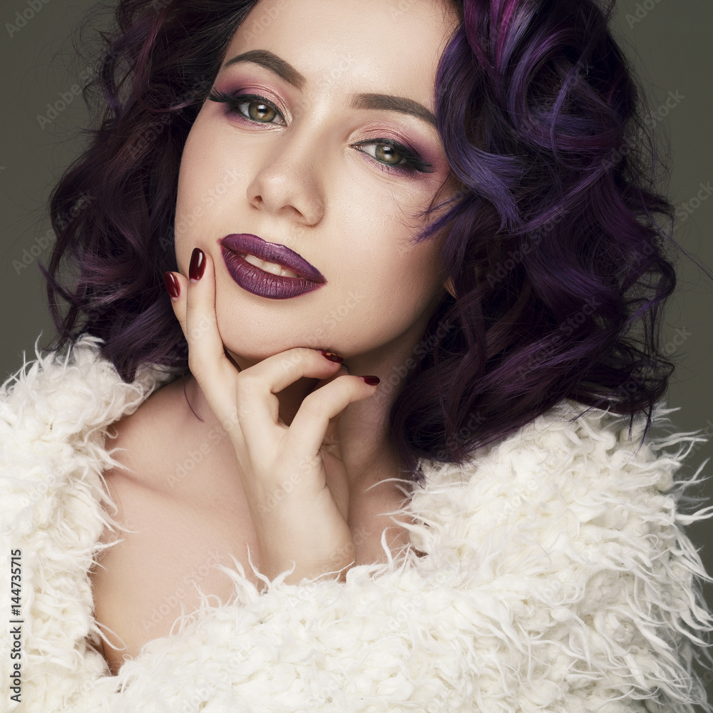 Portrait of young beautiful woman with violet make up and purple hair. Beauty concept. Portrait of young beautiful woman with violet make up and purple hair. Beauty concept.