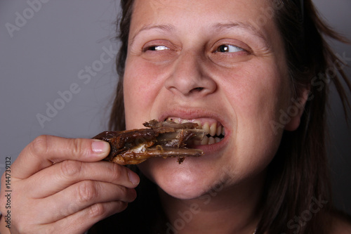 Woman eating meat © springtime78