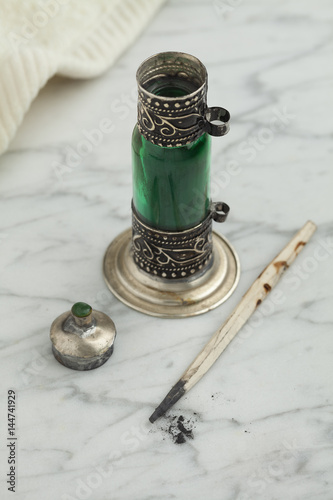 Moroccan green bottle with black kohl