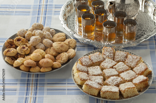 Traditional festive Moroccan cookies and tea photo