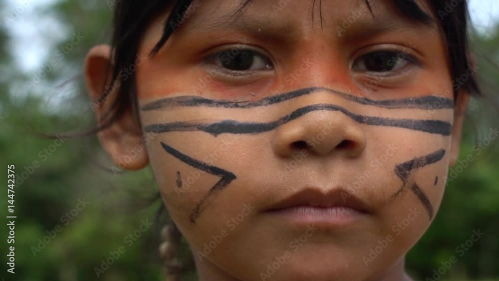 Closeup face of Native Brazilian children at an indigenous tribe in the Amazon
