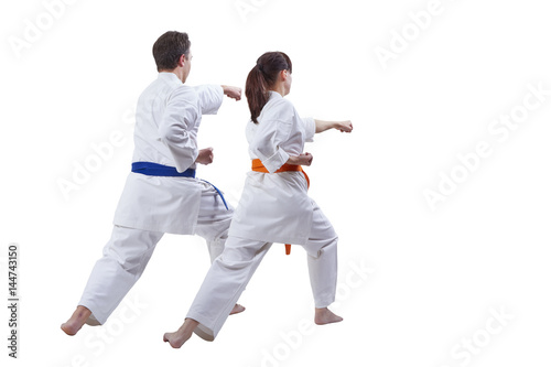 Husband and wife sportsmen beat a punch hand against a white background
