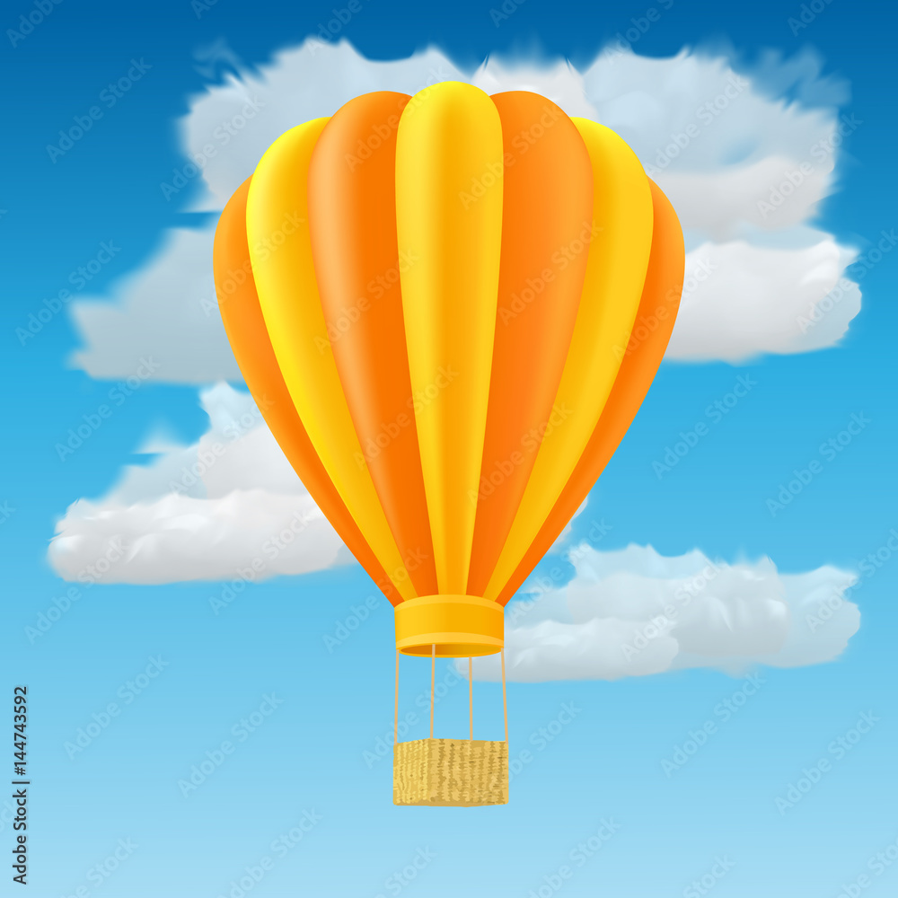 Naklejka premium Yellow and orange air ballon with basket