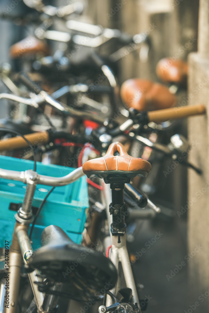 Obraz premium Leather saddle of old bicycle parked in the street of Budapest Jewish quarter, Hungary