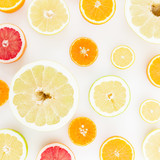 Tropical summer mix with fresh lemon, orange, mandarin, grapefruit and sweetie on white background. Flat lay, top view.