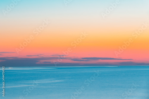 Calm Sea Or Ocean And Colorful Sunset Or Sunrise Sky Background. © Grigory Bruev