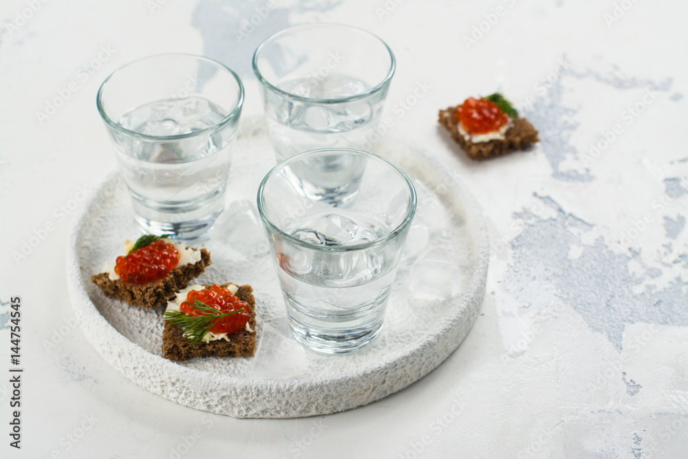 Vodka shots and red caviar sandwich Vodka shots and red caviar sandwich