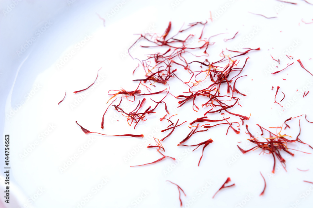 saffron pistil on white background Stock Photo | Adobe Stock