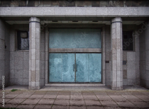 closed doors in a old derelict office building © philopenshaw