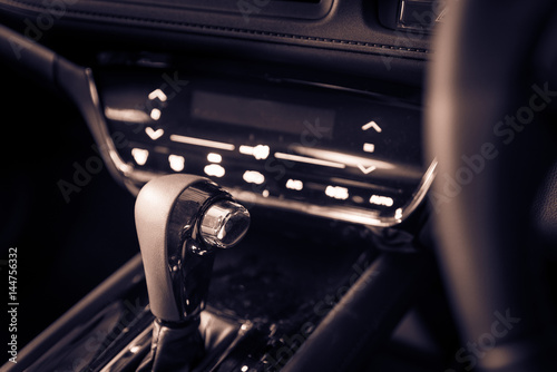 Closeup interior modern car console with full windscreen show space of front seat and passenger cabin , gear box , steering wheel and whole  dashboard function. © Goodvibes Photo