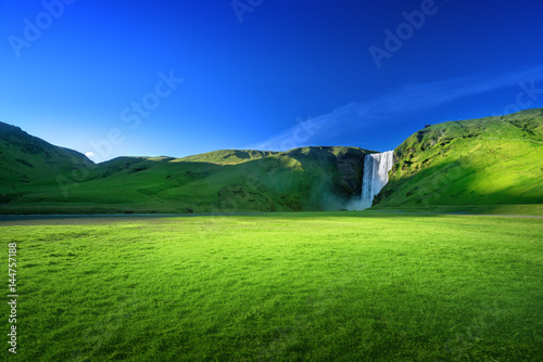 Skogarfoss waterfall and summer sunny day, Iceland