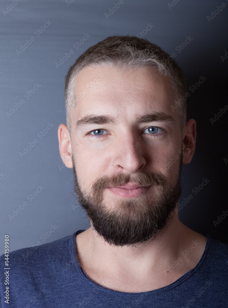Portrait of a young man with a beard Portrait of a young man with a beard