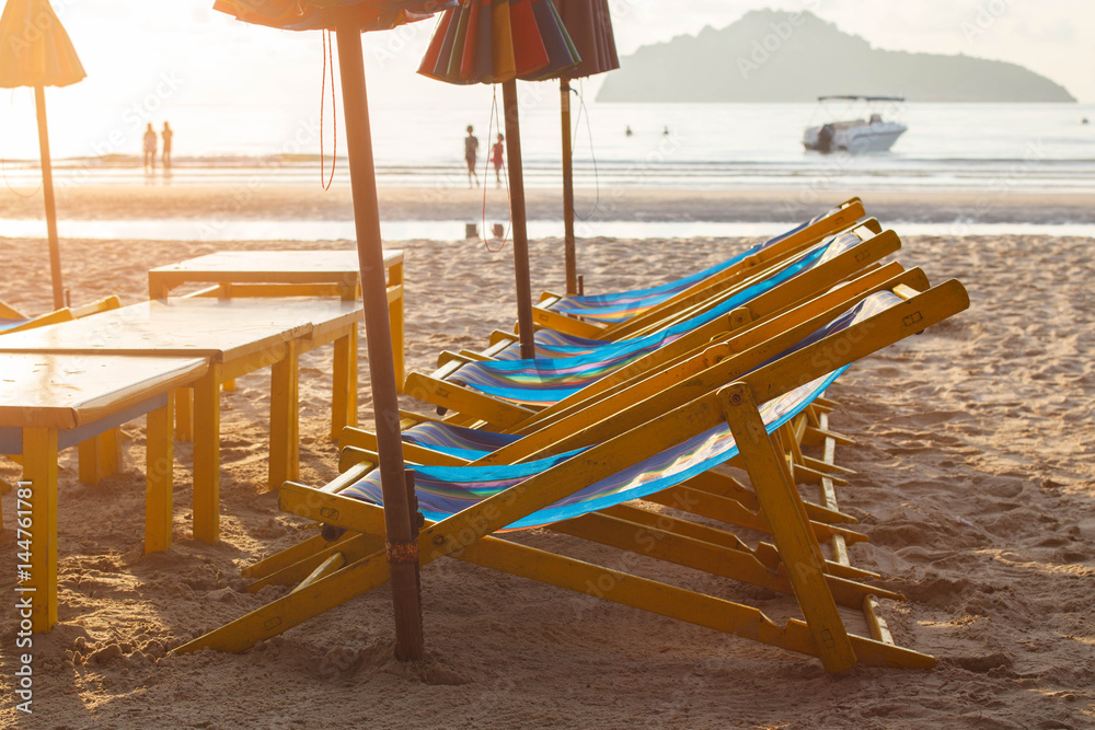 Beach chairs and umbrella on ocean beach in morning. Beach chairs and umbrella on ocean beach in morning.