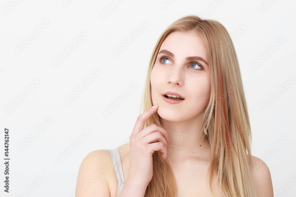 Closeup portrait of a beautiful young blond woman with clean face Closeup portrait of a beautiful young blond woman with clean face