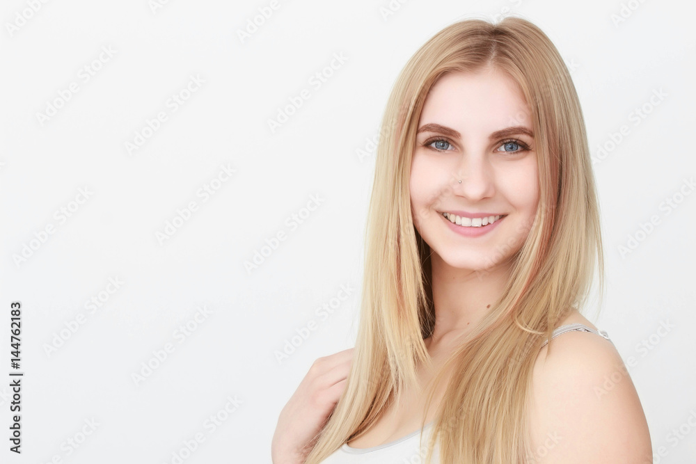 Closeup portrait of a beautiful young blond woman with clean face Closeup portrait of a beautiful young blond woman with clean face