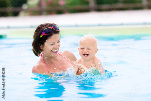 Mother and baby in swimming pool © famveldman