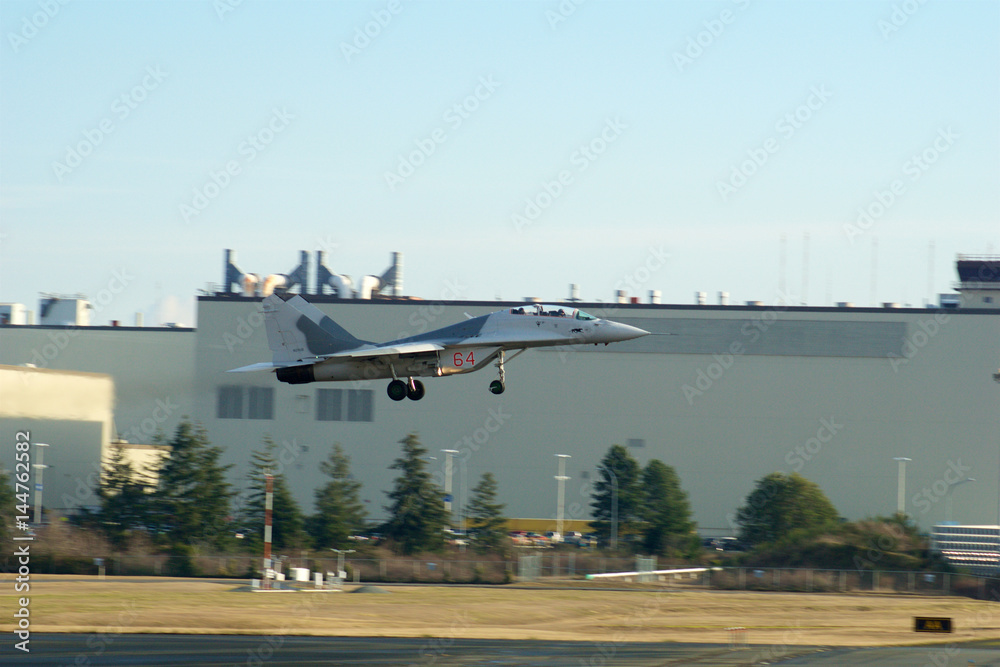Fototapeta premium EVERETT, WASHINGTON, USA - JAN 26th, 2017: A MiG-29UB during a low pass athe Boeing factory site at Snohomish County Airport or Paine Field