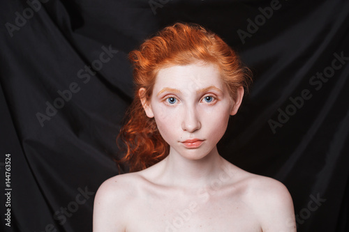 Woman With Long Curly Red Hair Gathered In Ponytail On Black Background Red Haired Girl With Pale Skin Blue Eyes Unusual Appearance Without Makeup Natural Beauty Girl From The Era Of Renaissance Stock