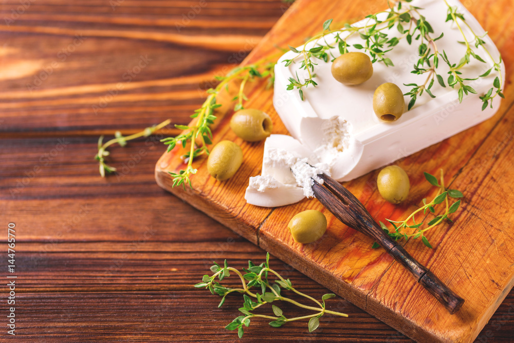 Greek cheese feta with thyme and green olives Greek cheese feta with thyme and green olives