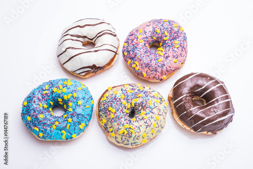 various color donuts on white background