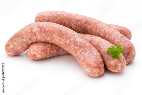 Cuadro en lienzo Raw sausage with parsley leaf isolated on white background.