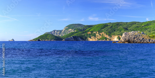 Beautiful summer panoramic seascape. View of the coastline into the sea bays with crystal clear azure water. Paleokastrica. Corfu. Greece.