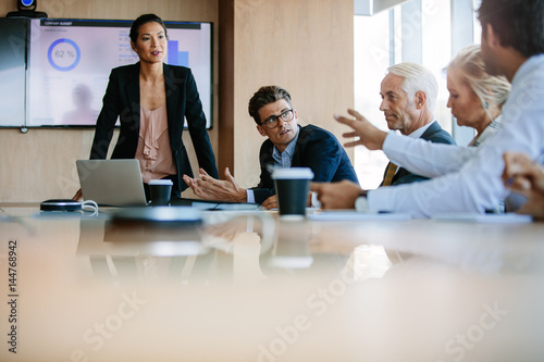Diverse business group having a meeting in boardroom photo