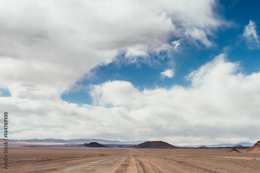 Dirt road with Antofagasta and Alumbrera volcanoes background in Catamarca, Argentina Dirt road with Antofagasta and Alumbrera volcanoes background in Catamarca, Argentina