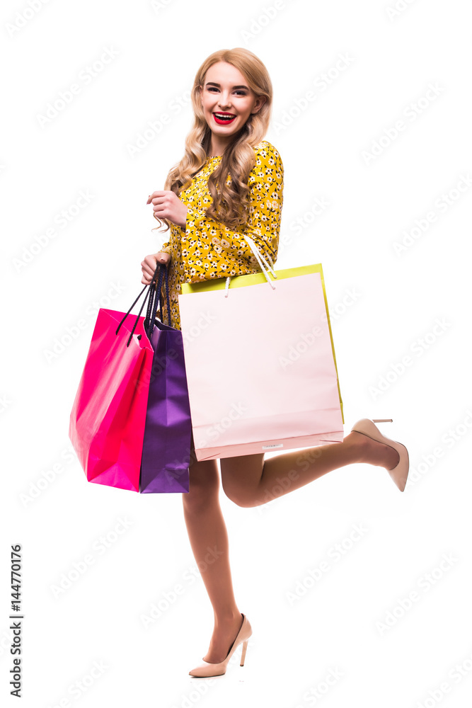Young woman with shopping bags in isolated white background