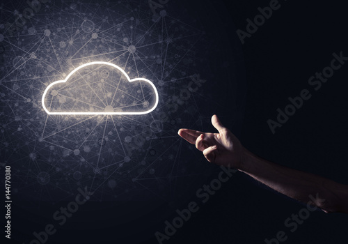 Digital cloud icon as symbol of wireless connection on dark back