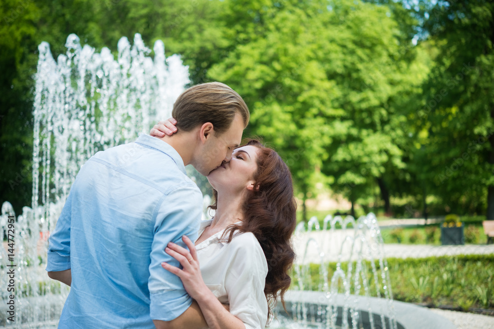 Fototapeta premium Couple kissing outdoors