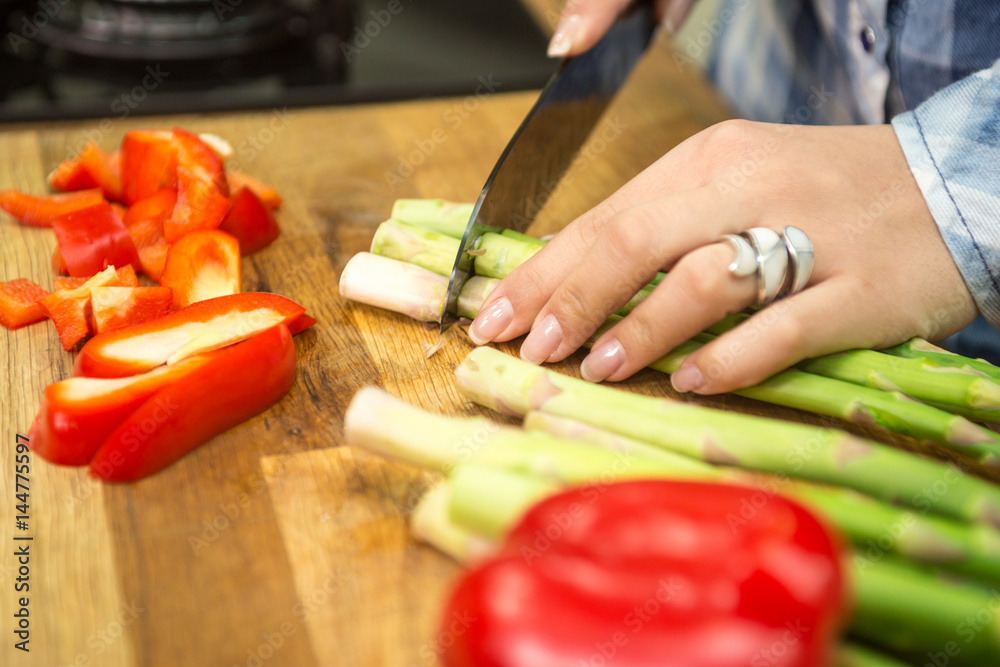 Chopping asparagus.