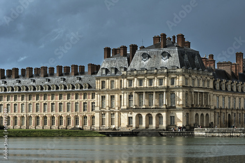 Pond and buildings of Fontainebleau Palace in France.