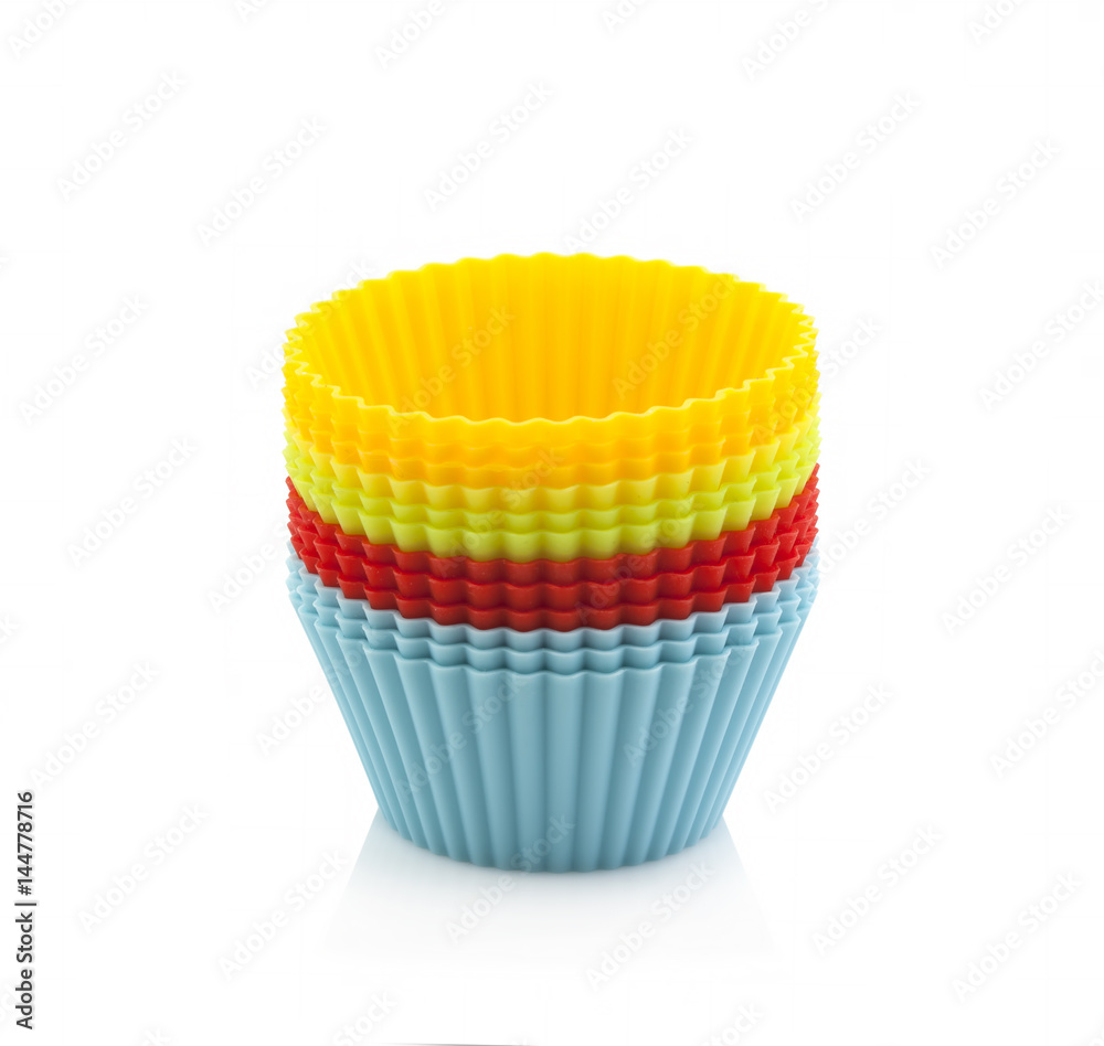 Colourful silicone form for cooking muffin and cupcake on a white background Colourful silicone form for cooking muffin and cupcake on a white background