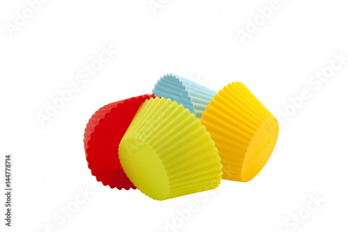Colorful silicone mold for making muffin and cupcake on a white background. Isolated