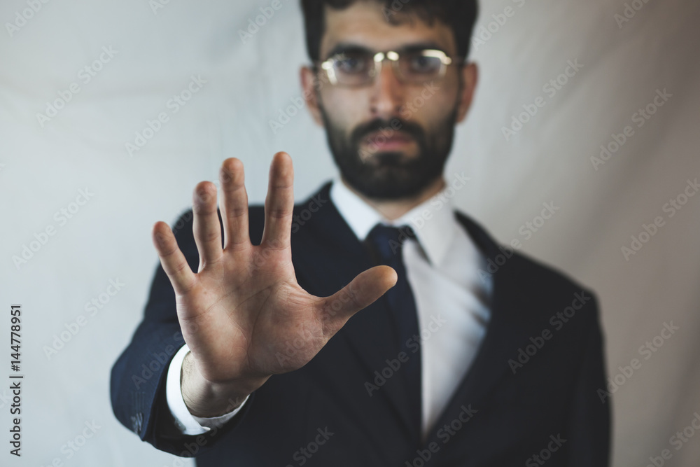 Business man showing stop hand gesture Business man showing stop hand gesture