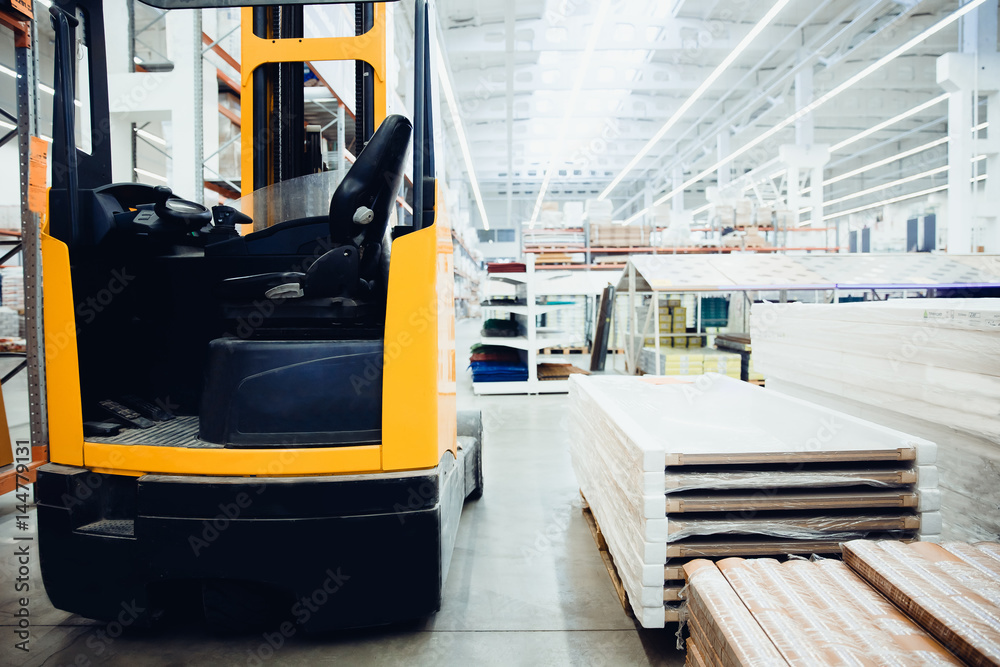 Building materials warehouse, logistics concept, construction of houses, loader. Building materials warehouse, logistics concept, construction of houses, loader.