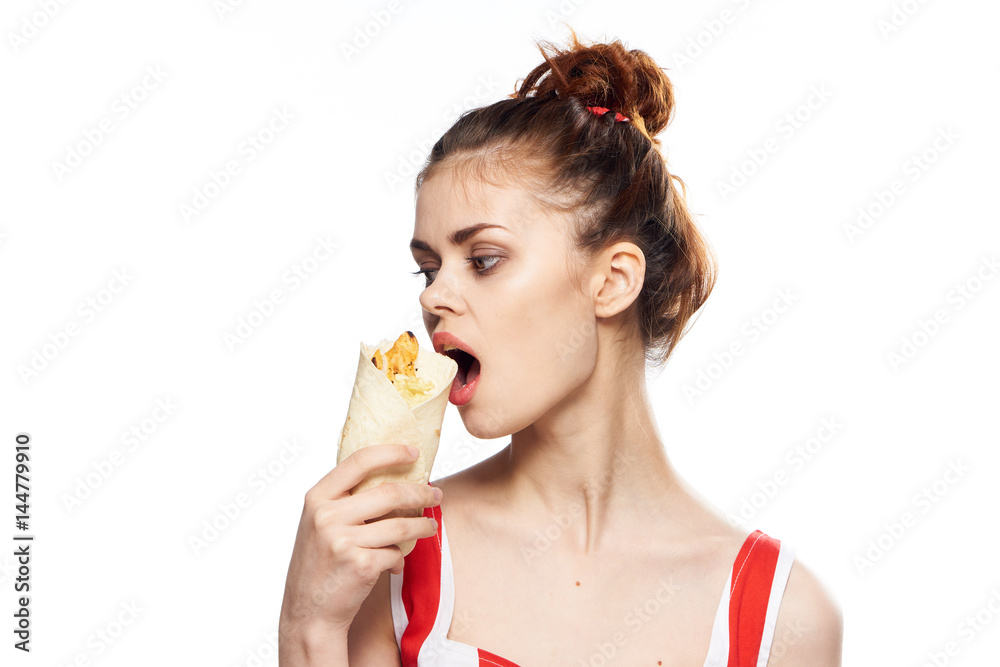 woman eating cake with meat and vegetables, fast food woman eating cake with meat and vegetables, fast food