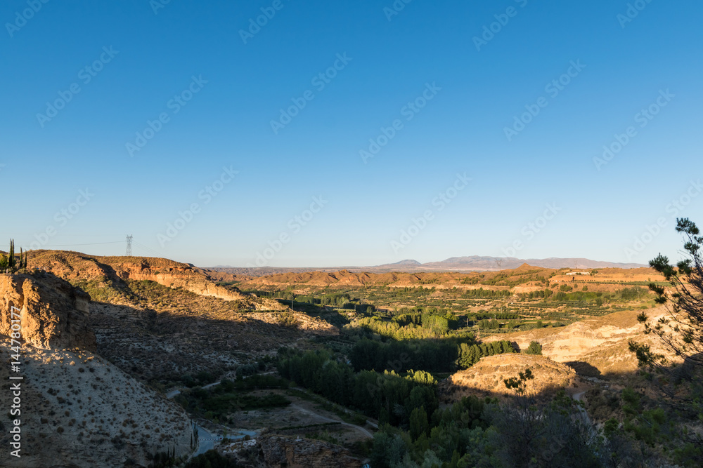 sunset over a canyon in the mountains