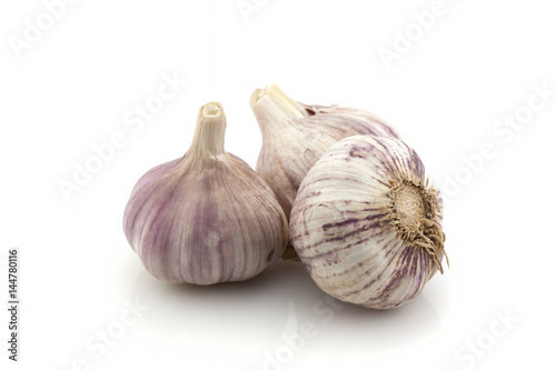 Old garlic whole on a white background. Isolated