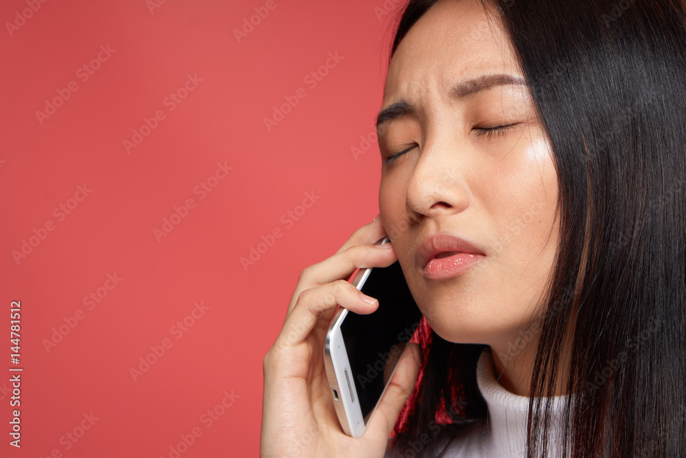 brunette with closed eyes talking on the phone brunette with closed eyes talking on the phone