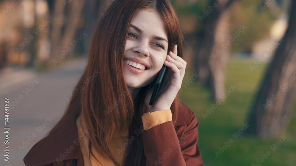 smiling woman talking on the phone outdoors smiling woman talking on the phone outdoors