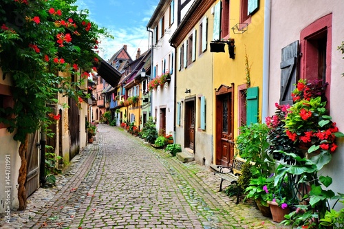 Picturesque street in the of the town of Eguisheim, Alsace, France © Jenifoto