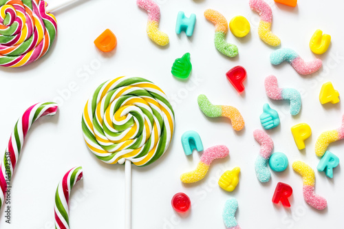sweets and sugar candies on white background top view pattern