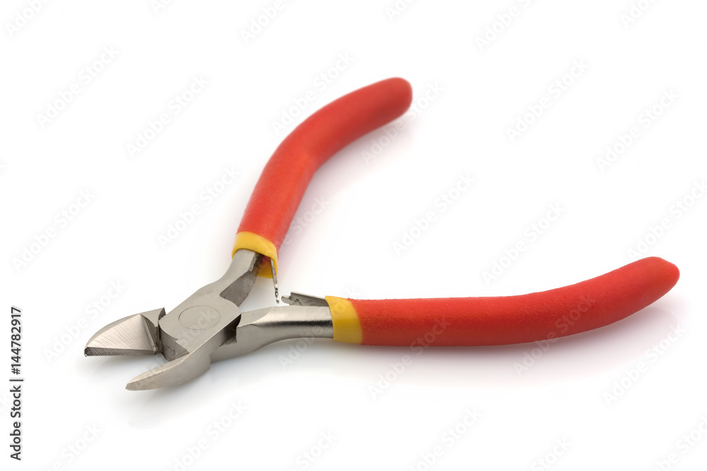 Tools for electricians. Nippers small blue on a wooden background Tools for electricians. Nippers small blue on a wooden background