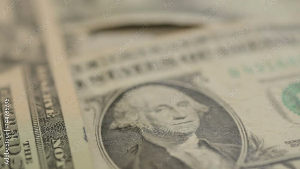 Different US dollar bills rotating background Different US dollar bills rotating background