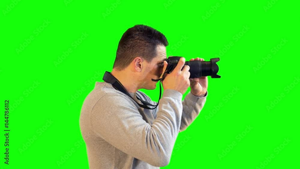 Greenscreen Photographer Side View Focusing and Zooming to Take Picture with DSLR Camera Greenscreen Photographer Side View Focusing and Zooming to Take Picture with DSLR Camera