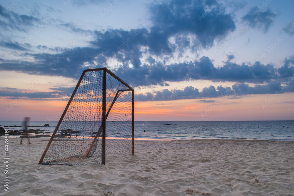 long exposure football goal on the beach in sunset long exposure football goal on the beach in sunset