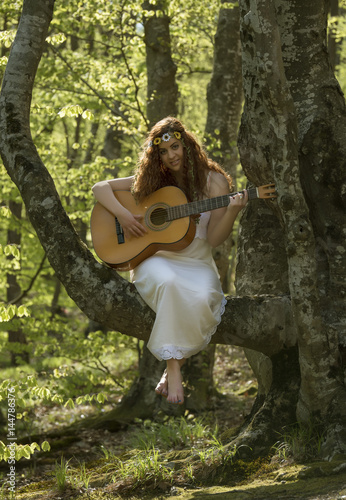 Girl with red hair playing guitar