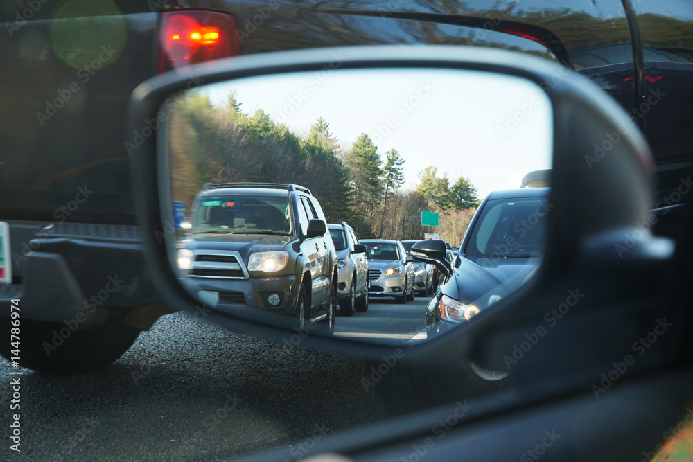vehicles in a row during traffic jam from car mirror